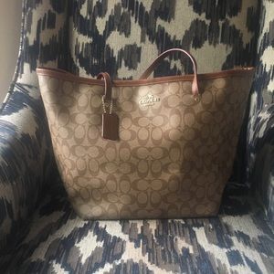 Brown signature Coach tote. Previously loved.